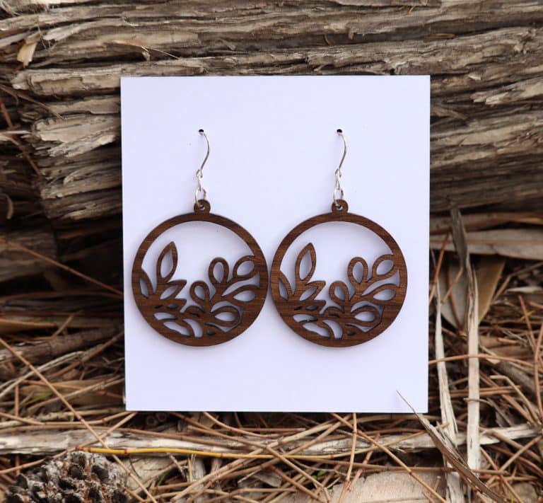 Round wooden queensland walnut earrings with intricate leaf pattern. Australian Made Round wooden queensland walnut earrings with intricate leaf pattern. Australian Made
