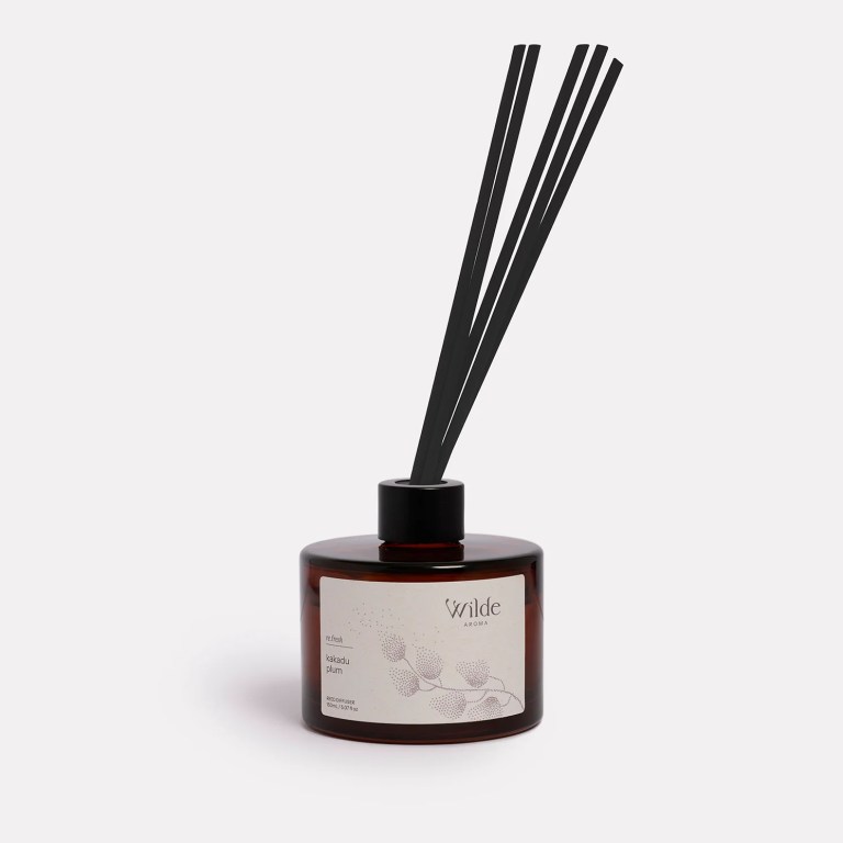 wilde aroma reed diffuser kakadu plum Kakadu plum diffuser with reeds in glass bottle.