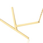 Gold abstract pendant necklace on chain.