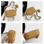 black trendy crossbody shoulder bag with tassel accent compact and stylish
