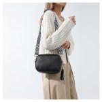 black trendy crossbody shoulder bag with tassel accent compact and stylish