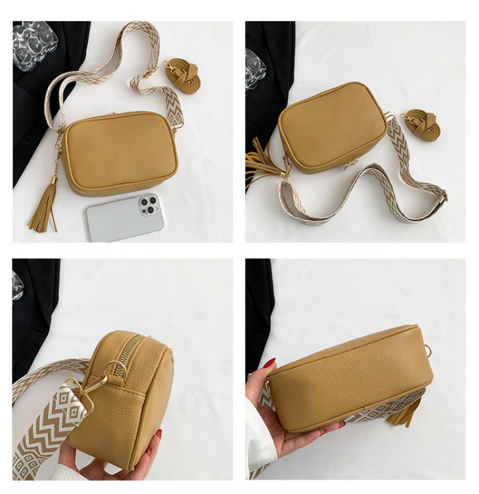 white trendy crossbody shoulder bag with tassel accent compact and stylish