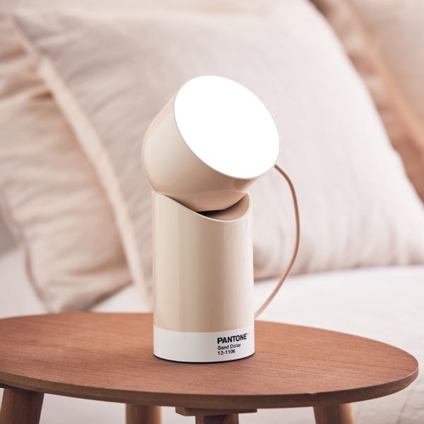 lexon orbe portable led lamp with moving head pantone sand