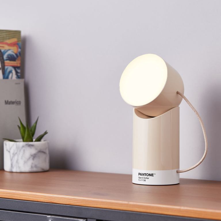 lexon orbe portable led lamp with moving head pantone sand