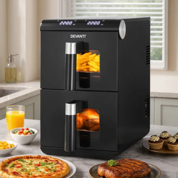 Dual air fryer with cooked food on kitchen counter.