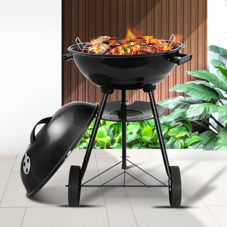bbq agrill st rebk 202502281644 00.jpg Charcoal BBQ sizzling in backyard garden.
