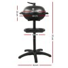 Black barbecue grill with measurements displayed.