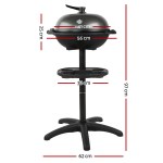 Black barbecue grill with measurements displayed.