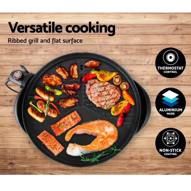 Versatile grill with thermostat, non-stick surface.