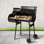 bbq smoker offset 202502281646 00.jpg Outdoor barbeque grill with food and condiments.