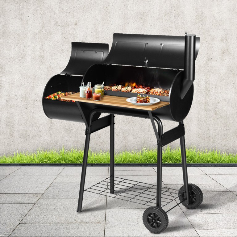 bbq smoker offset 202502281646 00.jpg Outdoor barbeque grill with food and condiments.