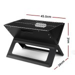 Compact black barbecue grill with dimensions shown.