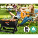 Outdoor BBQ with guitar and relaxation.
