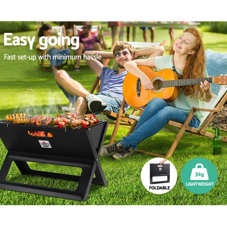 Outdoor BBQ with guitar and relaxation.