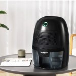devanti dehumidifier 600ml air purifier black Black dehumidifier on round table indoors.