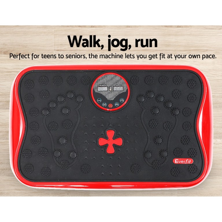 everfit vibration machine platform vibrator with resistance rope home gym red Red exercise vibration plate on wooden floor.