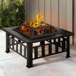 Outdoor fire pit with burning fire on patio.