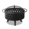 Black outdoor fire pit with mesh cover.