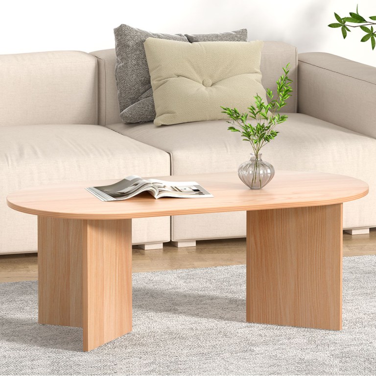 Oval table with book and vase in lounge.