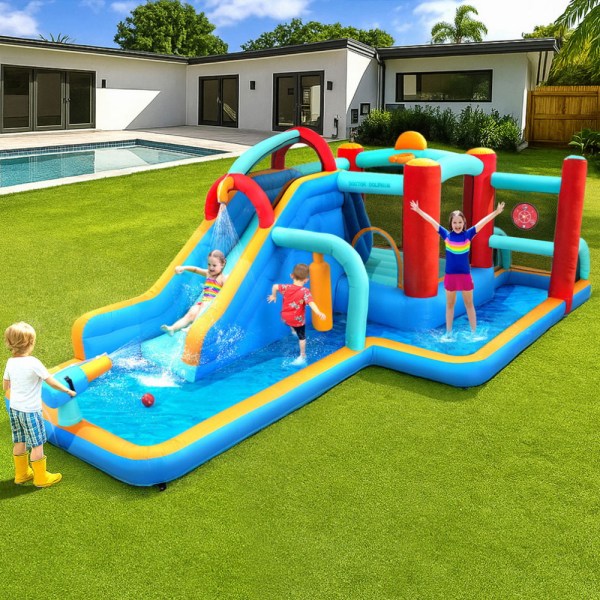 Kids playing on colourful inflatable water slide.