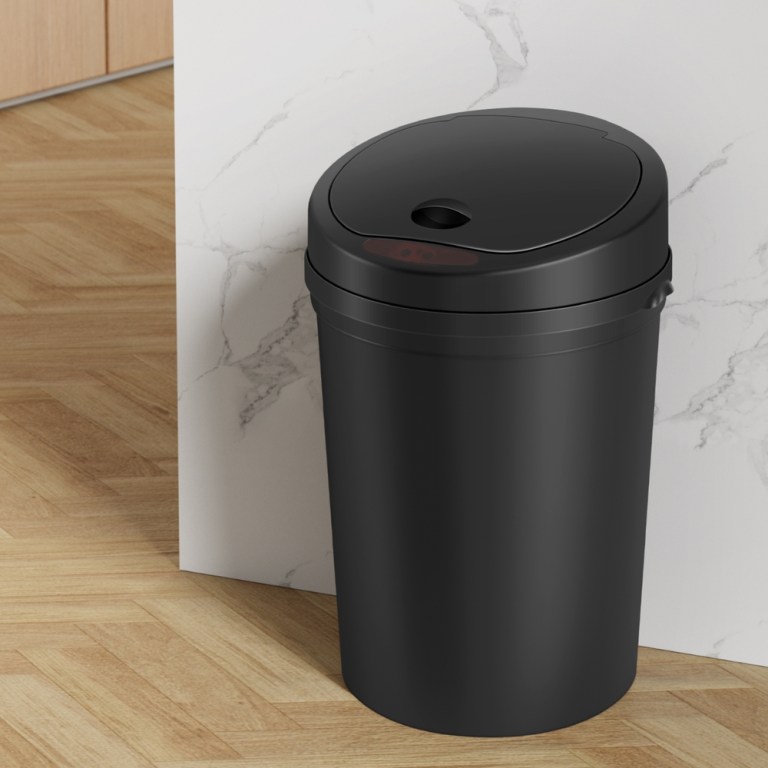 Black bin in modern kitchen corner