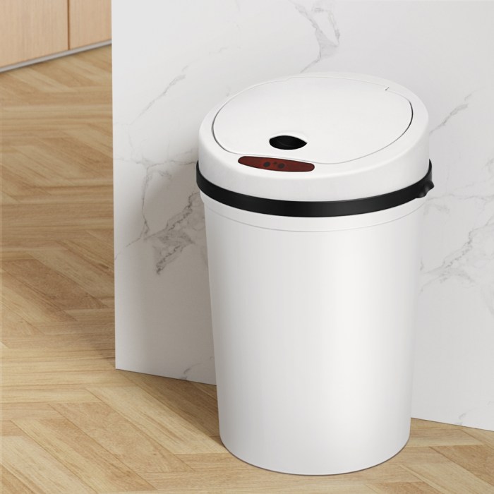 White touchless kitchen bin on wooden floor