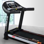 Black treadmill in modern home gym setting.