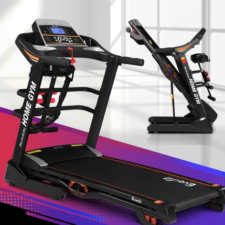 Foldable treadmill for home gym with digital display.