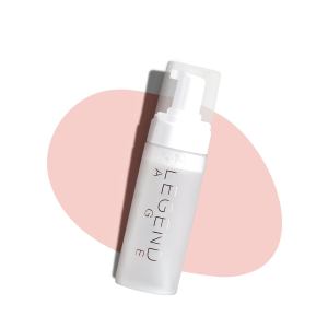 Legend Age skincare bottle on pink oval background