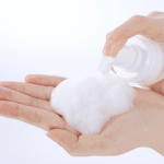 Foaming soap dispensed onto hand.