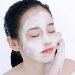cleansing mousse | makeup removal | deep cleansing | nourishing Woman applying facial cleanser foam, eyes closed.