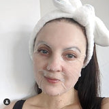 hydrating face mask | super hydration | silky skin & fine pore Woman wearing sheet mask and headband.