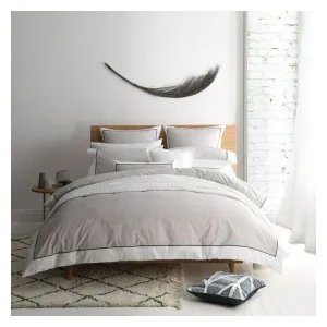 Modern bedroom with stylish decor and cosy bedding.