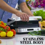 Person using stainless steel sandwich press in kitchen.