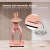 Woman exercises on vibration platform with LED display.