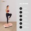 Woman using vibration platform for fitness benefits.