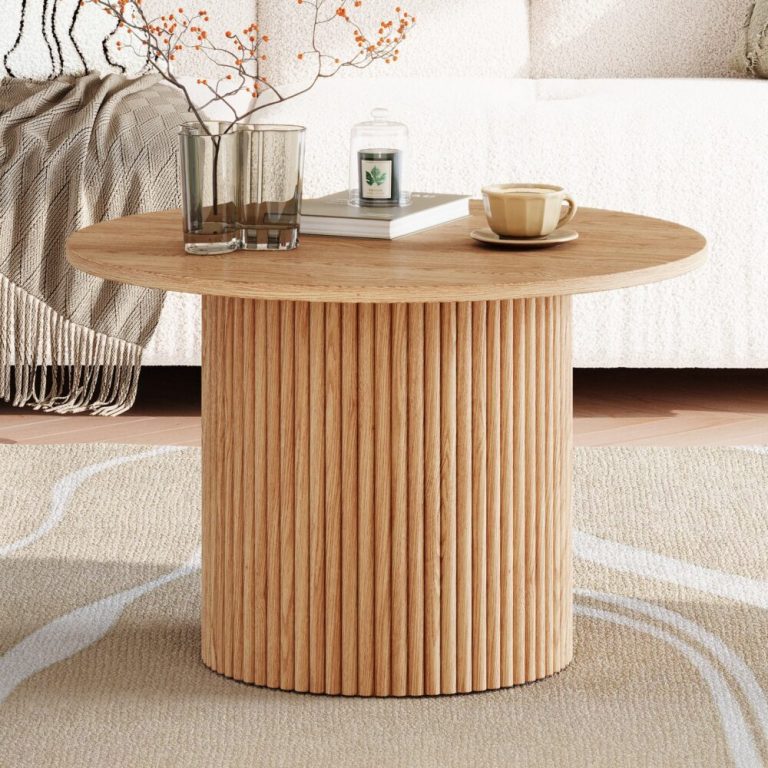 Wooden coffee table with plants and cups.
