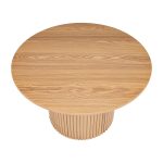 Round wooden table with textured base