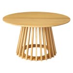 palmer coastal haven natural coffee table Round wooden table with slatted base design.