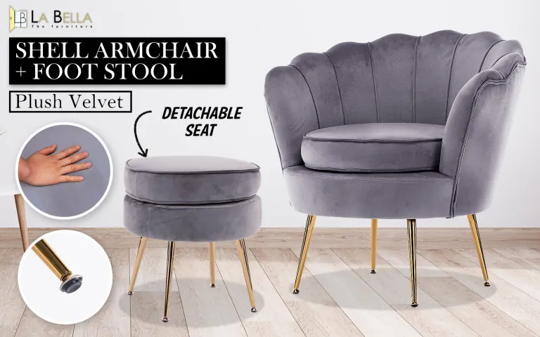 Grey velvet shell armchair with footstool on wooden floor.