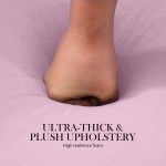 ottoman foot stool velvet fabric metal leg round pink Hand pressing into plush upholstery foam.