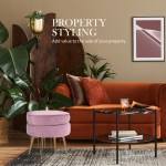 ottoman foot stool velvet fabric metal leg round pink Stylish living room with vibrant decor and plants.
