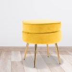 ottoman foot stool velvet fabric metal leg round yellow Yellow velvet ottoman with gold legs on wood floor.
