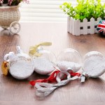 Decorative ornaments with ribbons on wooden table.
