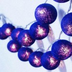 Purple fairy lights glowing in a row