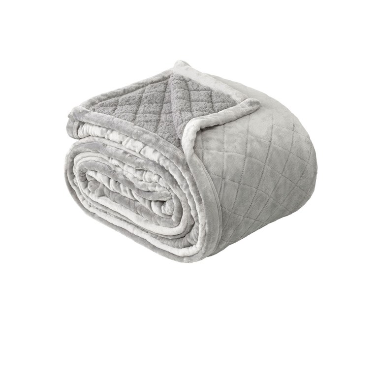 Soft grey quilted blanket rolled up