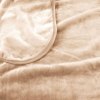 Soft beige fleece blanket close-up view.