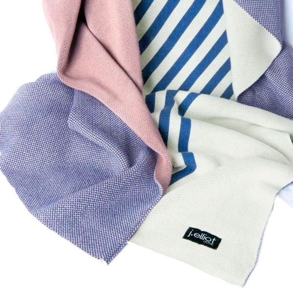 Colourful woven blankets with stripes and patterns.