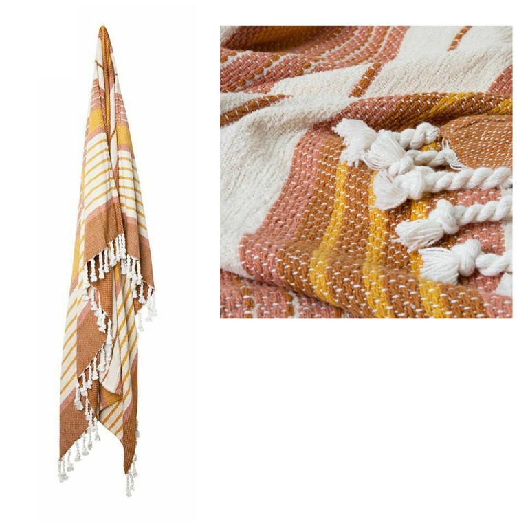 Colourful woven blanket with tassel details.