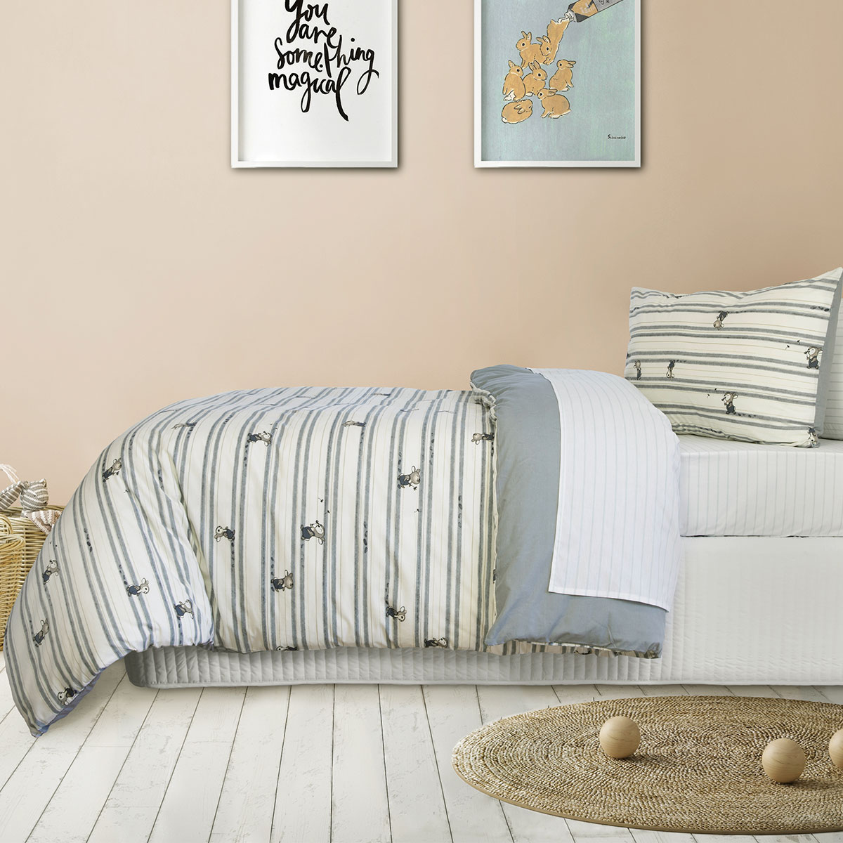 Striped bed linen in cosy bedroom decor.